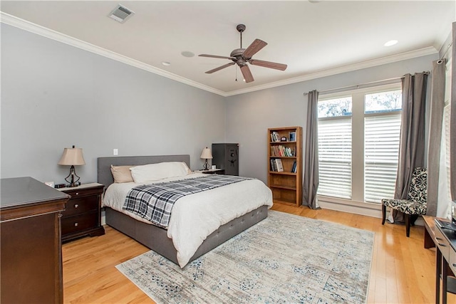 26 Pine Ln, Hammond, LA 70401 - bedroom with light wood finished floors, visible vents, a ceiling fan, and ornamental molding