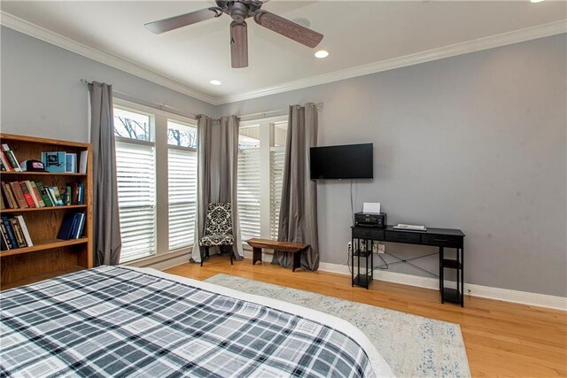 bedroom with ceiling fan, wood-type flooring, and ornamental molding