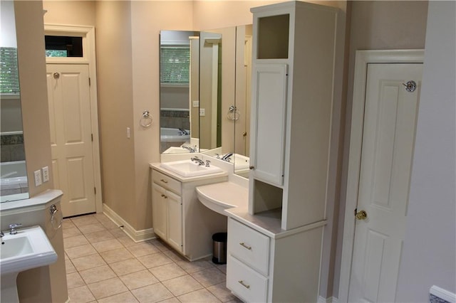 26 Pine Ln, Hammond, LA 70401 - bathroom featuring tile patterned floors, a sink, and baseboards