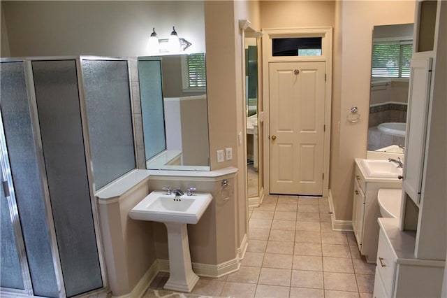 26 Pine Ln, Hammond, LA 70401 - full bathroom with tile patterned flooring, a shower stall, and baseboards