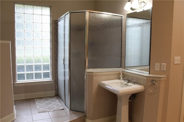 26 Pine Ln, Hammond, LA 70401 - full bath featuring tile patterned floors, a shower stall, baseboards, and healthy amount of natural light