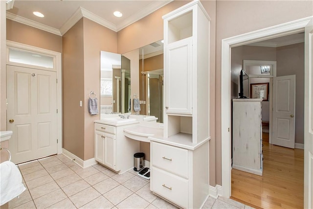 bathroom with vanity, tile patterned floors, and ornamental molding