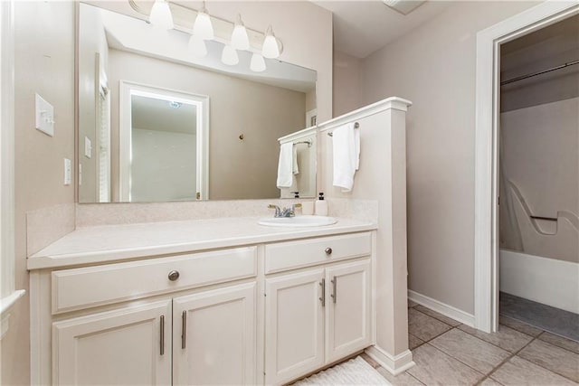 bathroom featuring tile patterned flooring, vanity, and shower / tub combination