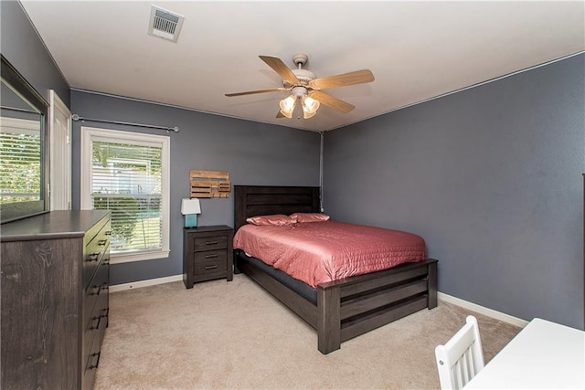 bedroom with light carpet and ceiling fan