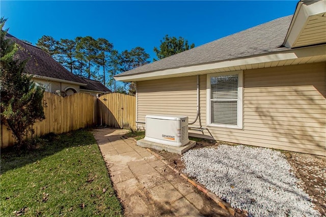 26 Pine Ln, Hammond, LA 70401 - view of side of property featuring a lawn, a shingled roof, and fence