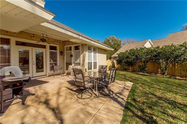 26 Pine Ln, Hammond, LA 70401 - view of patio / terrace with french doors, fence, a ceiling fan, and outdoor dining space