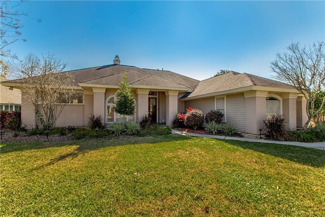 26 Pine Ln, Hammond, LA 70401 - ranch-style house featuring stucco siding, a chimney, and a front yard