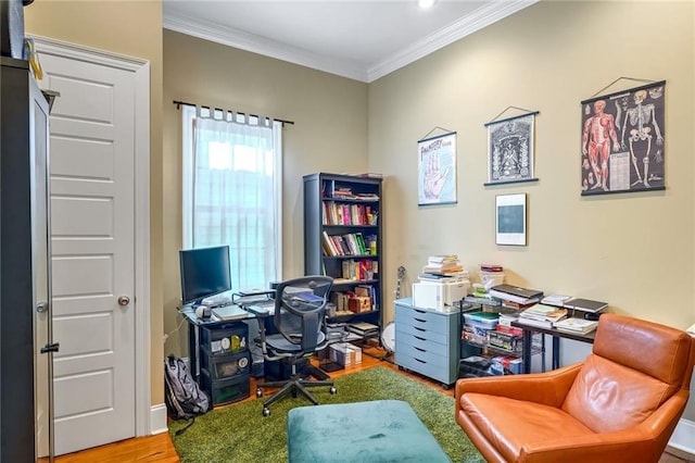 home office with ornamental molding and hardwood / wood-style flooring