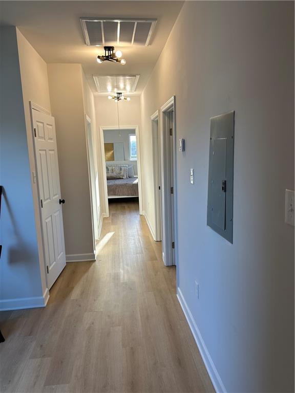 kitchen featuring white cabinets, ceiling fan, light hardwood / wood-style floors, and sink