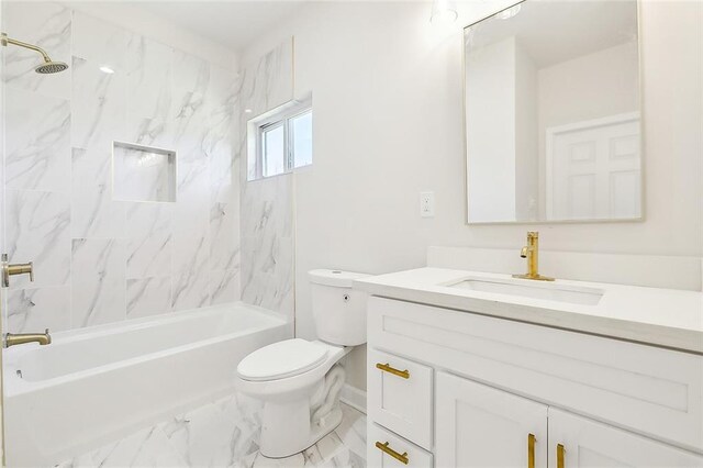 full bathroom featuring vanity, toilet, and tiled shower / bath