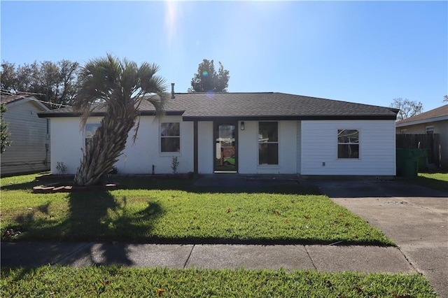 ranch-style home with a front yard