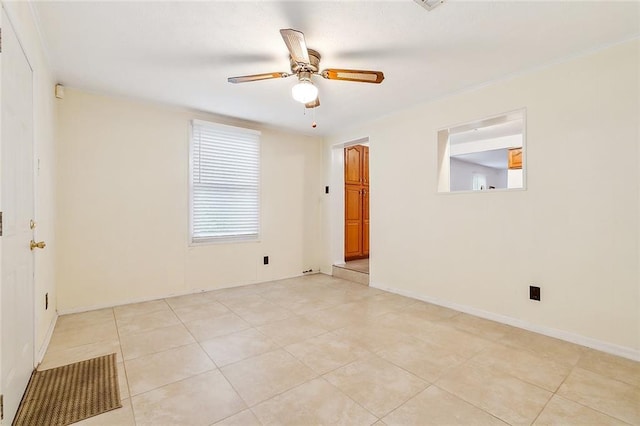 tiled empty room with ceiling fan