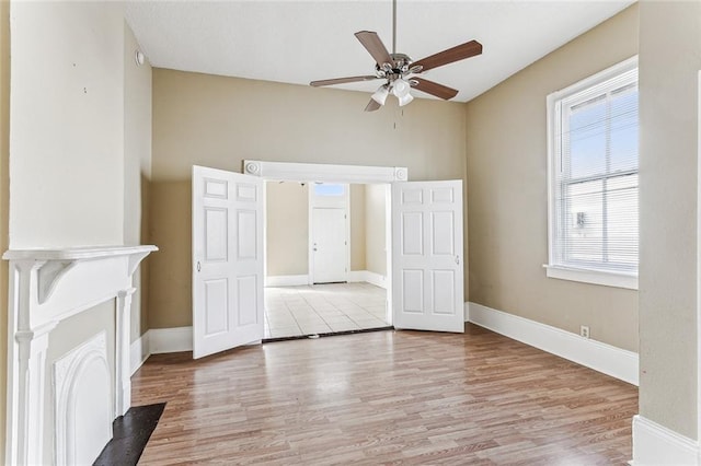 unfurnished bedroom featuring ceiling fan and light wood-type flooring