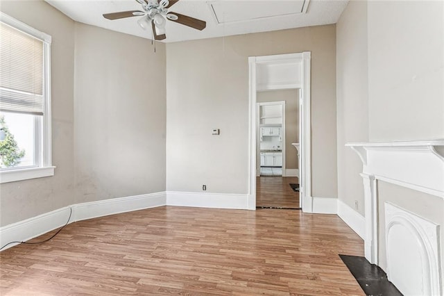 spare room featuring ceiling fan and light hardwood / wood-style flooring