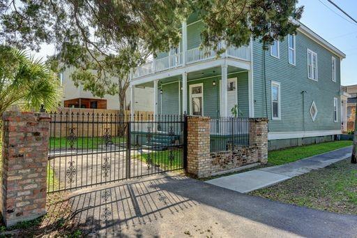 view of front of home with a balcony and a porch