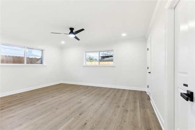 empty room with light hardwood / wood-style flooring, ceiling fan, and ornamental molding