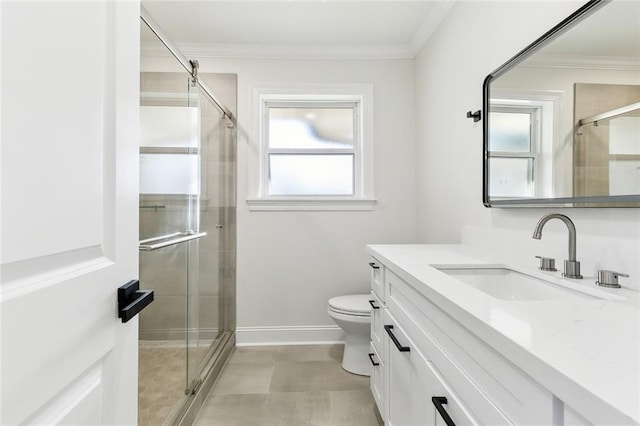 bathroom featuring an enclosed shower, vanity, toilet, and crown molding