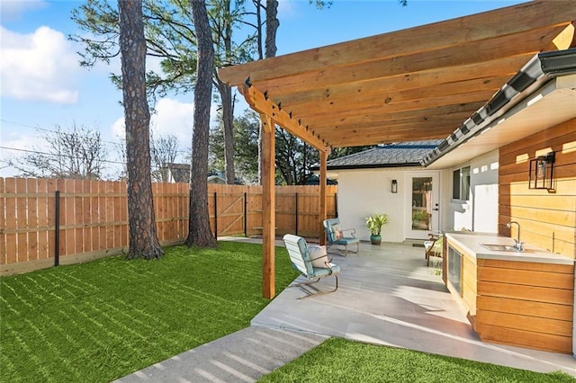 view of yard featuring a pergola and sink