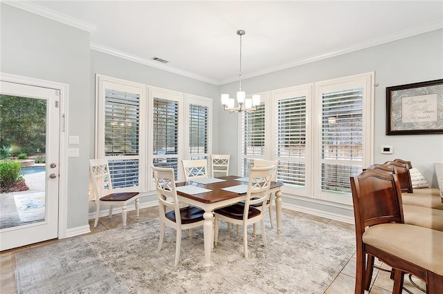 tiled dining space featuring ornamental molding, a healthy amount of sunlight, and a notable chandelier