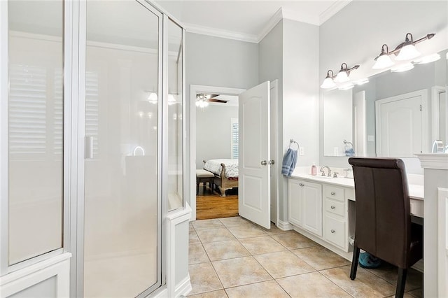 bathroom with ceiling fan, walk in shower, tile patterned flooring, crown molding, and vanity