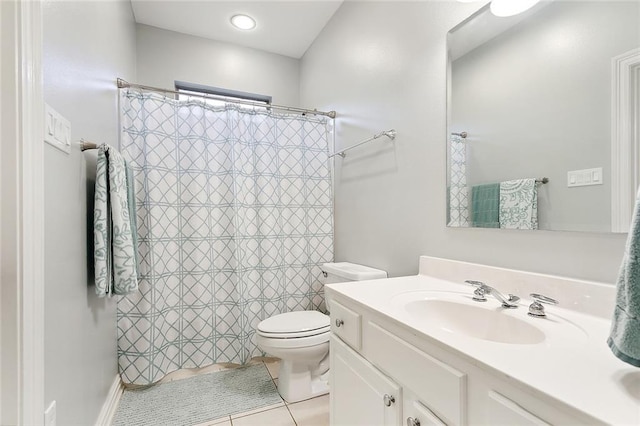 bathroom featuring tile patterned floors, curtained shower, vanity, and toilet