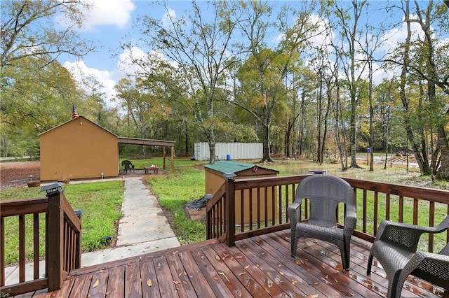 wooden terrace featuring a yard and a storage shed