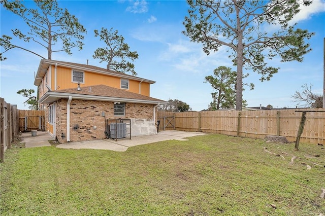 back of house featuring a patio, cooling unit, and a lawn