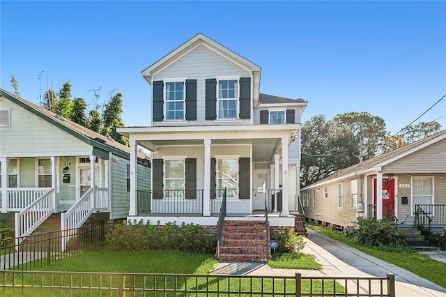 view of front facade with covered porch and a front lawn