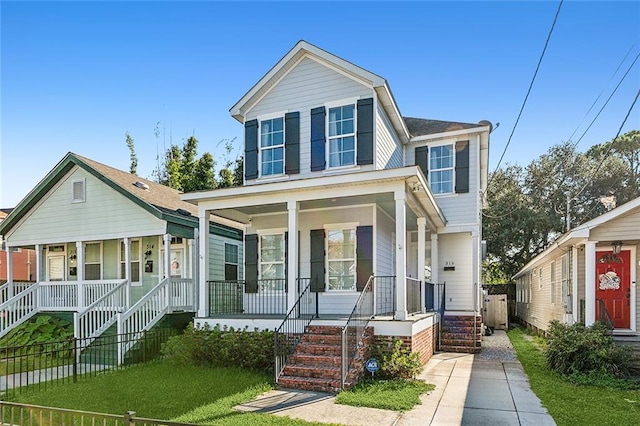 view of front of house featuring a porch and a front yard