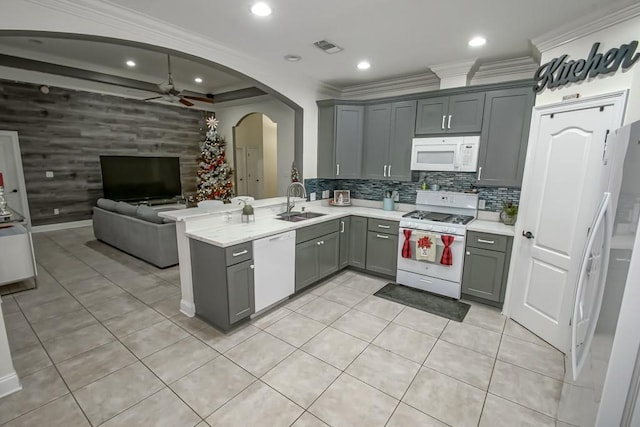 kitchen with ornamental molding, gray cabinetry, white appliances, ceiling fan, and sink