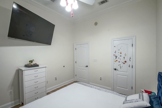 bedroom featuring ceiling fan, wood-type flooring, and ornamental molding