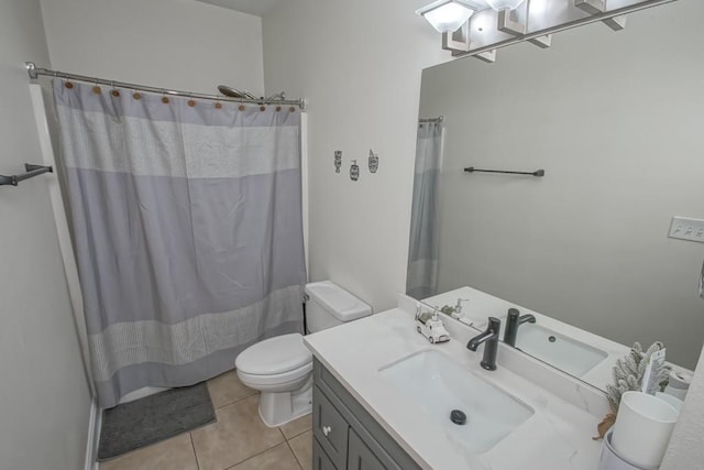 bathroom featuring curtained shower, tile patterned flooring, vanity, and toilet