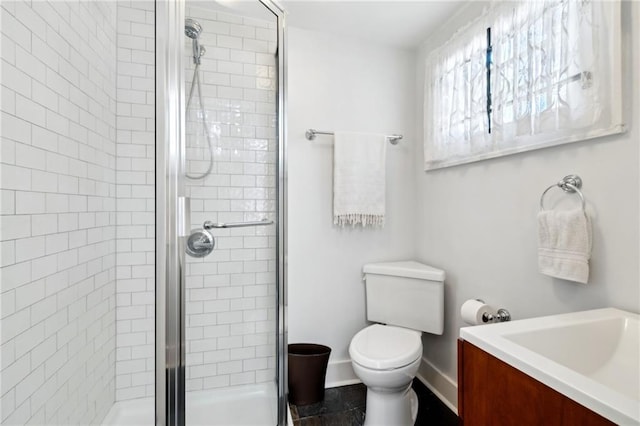 bathroom with toilet and walk in shower