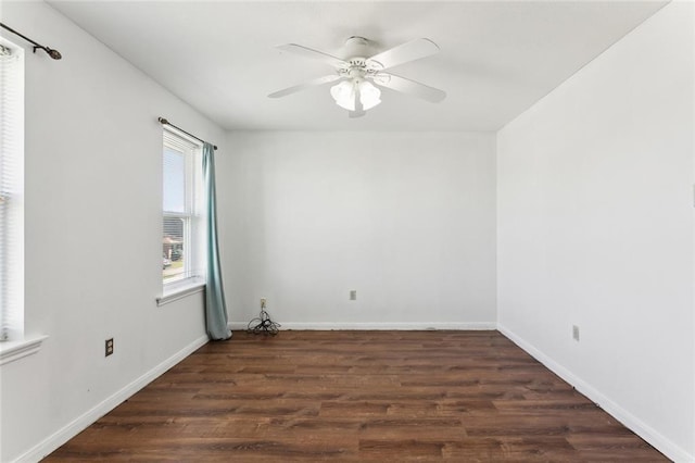 unfurnished room featuring ceiling fan and dark hardwood / wood-style flooring