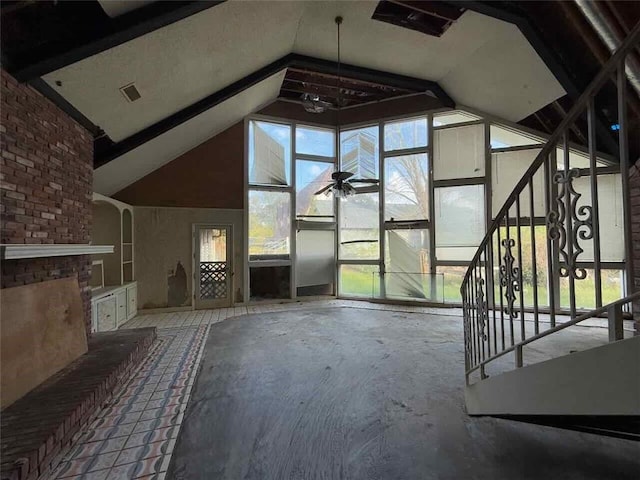 unfurnished living room with high vaulted ceiling and ceiling fan