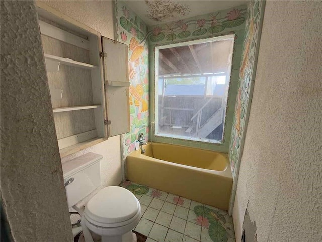 235 S Acadian Thruway, Baton Rouge, LA 70806 - bathroom featuring a bathtub and tile patterned flooring