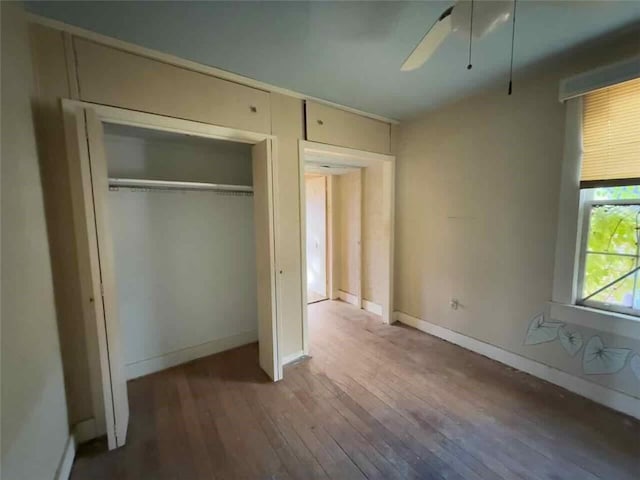 235 S Acadian Thruway, Baton Rouge, LA 70806 - unfurnished bedroom featuring wood-type flooring, a closet, and ceiling fan