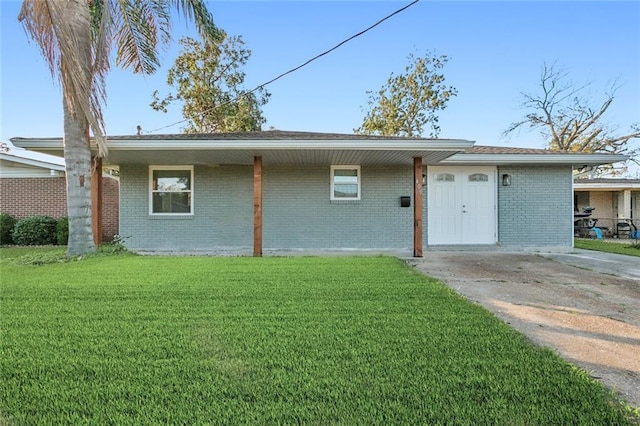 ranch-style house with a front lawn