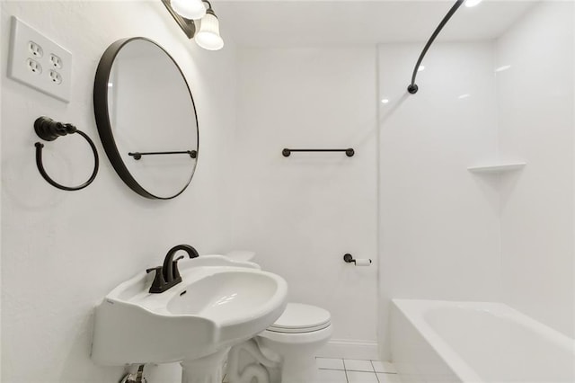 bathroom with sink, tile patterned flooring, and toilet