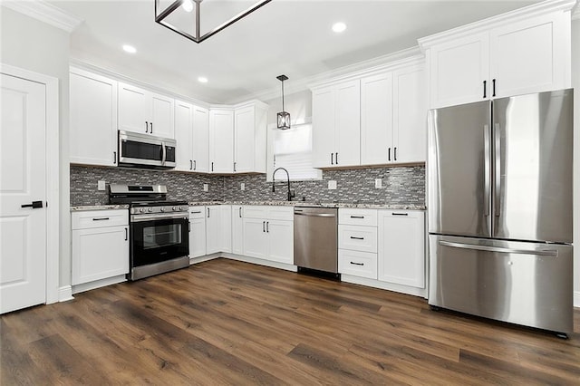 kitchen with stainless steel appliances, decorative light fixtures, white cabinetry, light stone counters, and dark wood-type flooring