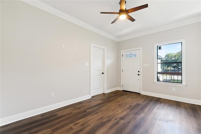 entryway with ornamental molding, ceiling fan, and dark hardwood / wood-style floors