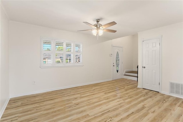 spare room with light hardwood / wood-style floors and ceiling fan