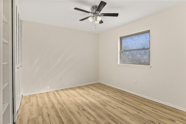 spare room featuring ceiling fan and light hardwood / wood-style flooring