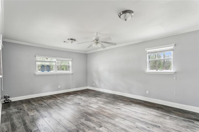 unfurnished room featuring dark hardwood / wood-style flooring, plenty of natural light, crown molding, and ceiling fan