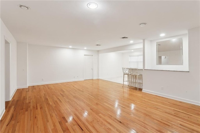 unfurnished room with light hardwood / wood-style floors