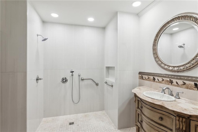 bathroom featuring a shower and vanity