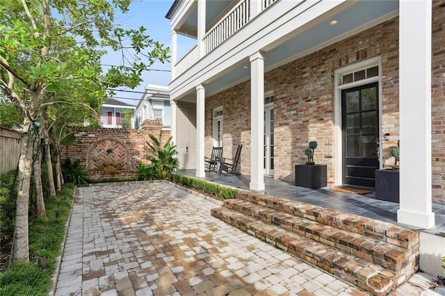 view of patio with a balcony