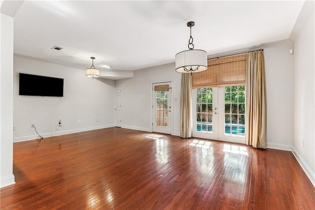 unfurnished living room with hardwood / wood-style flooring, french doors, and ornamental molding