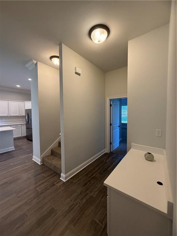 hall with dark hardwood / wood-style floors