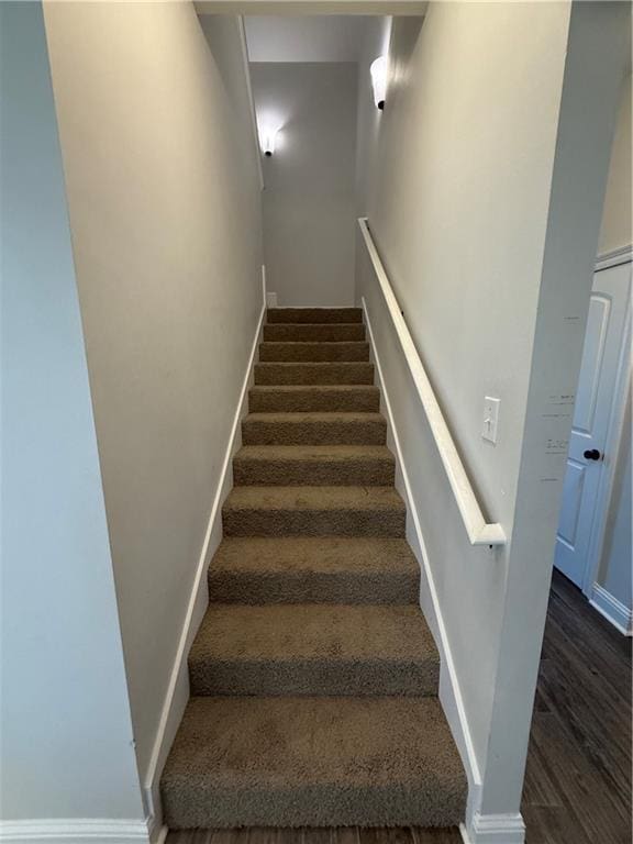 stairway with wood-type flooring